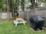 Fenced in yard with new picnic table and new gass grill